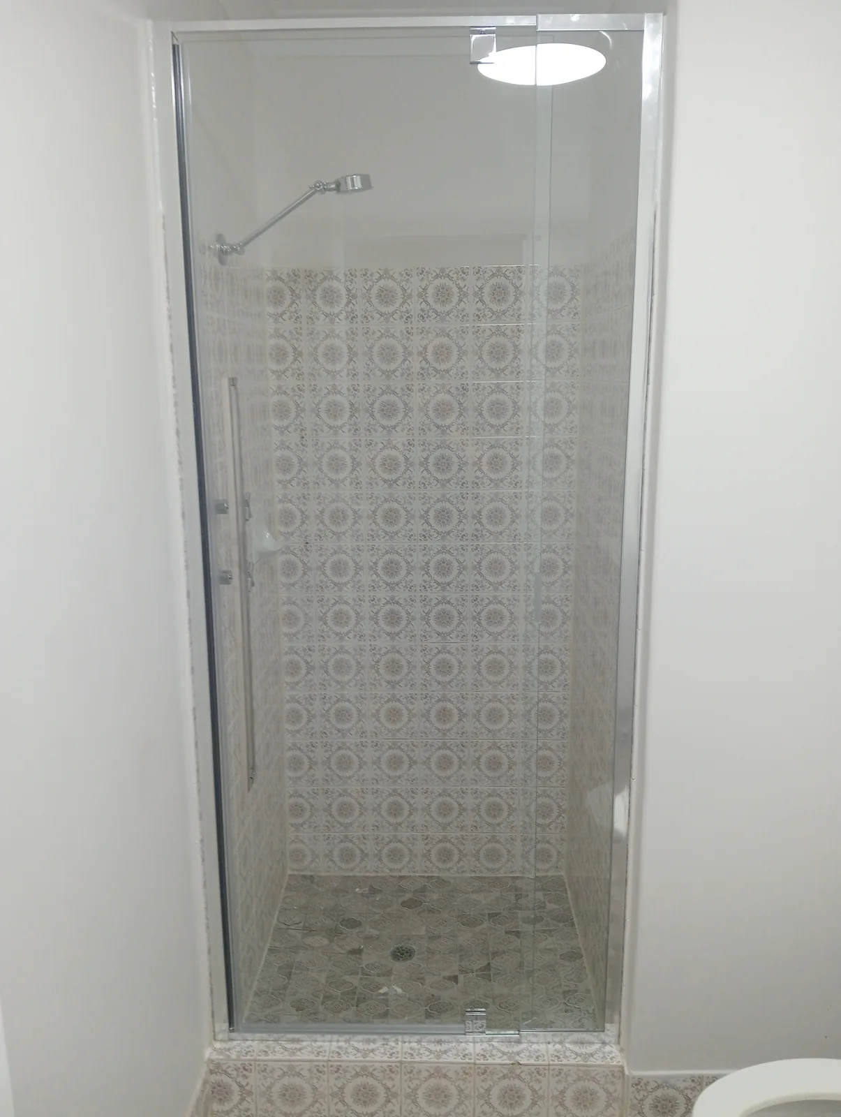 Tiled shower with completed glass screen